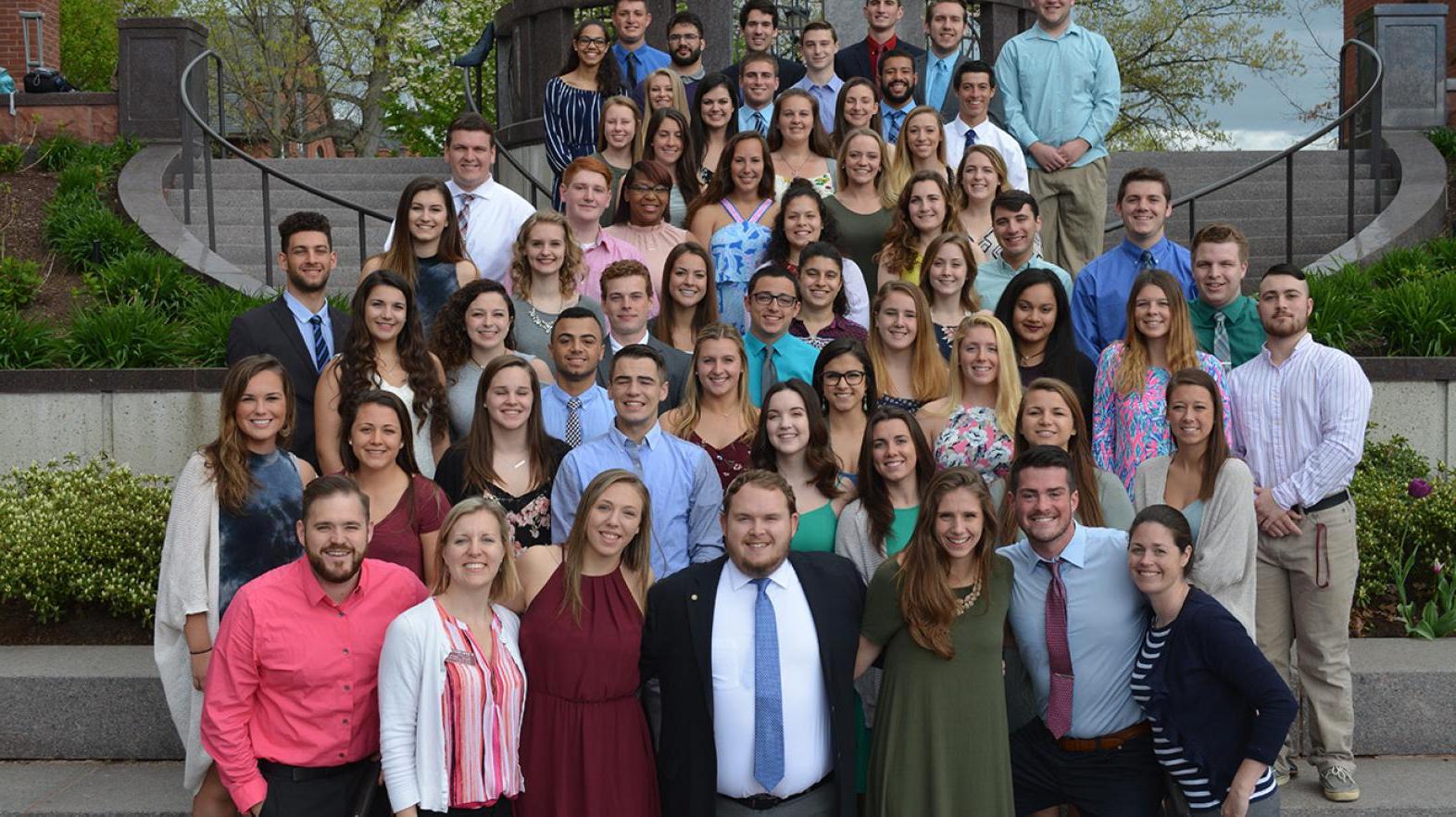 New Student Orientation Leaders pose on the steps outside of the campus union